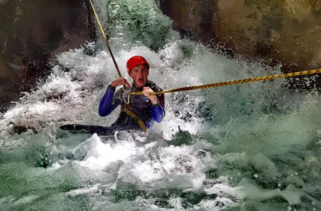 Canyoning through fast water in Hrcavka Canyon Sutjeska National Park Bosnia