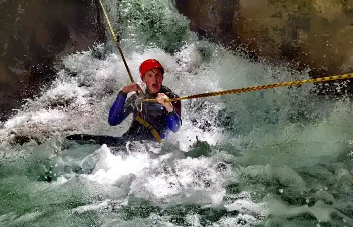 Canyoning through fast water in Hrcavka Canyon Sutjeska National Park Bosnia