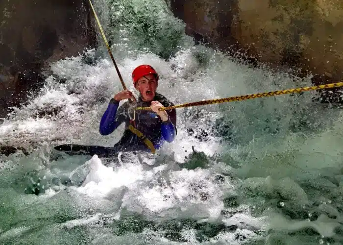 Canyoning through fast water in Hrcavka Canyon Sutjeska National Park Bosnia