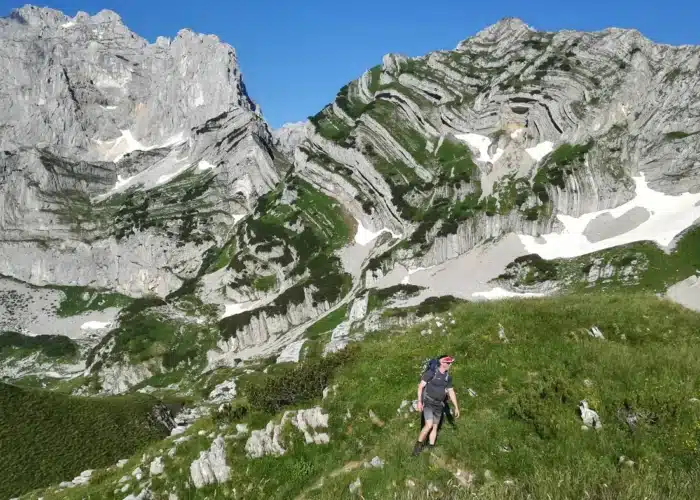Rocky hiking trail leading toward Bobotov Kuk summit